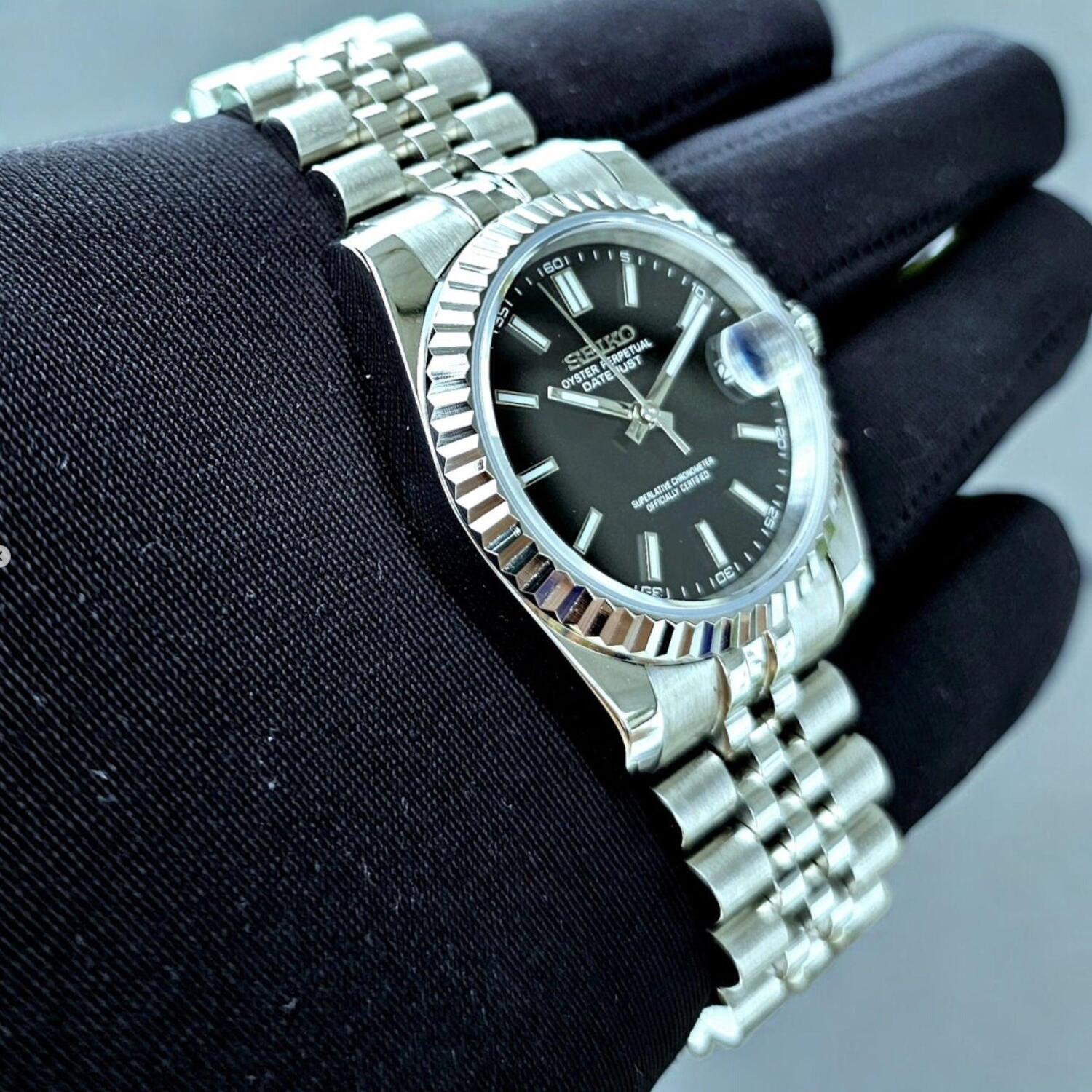 Seiko Mod Datejust Black Dial close up left angle showing fluted bezel and date magnifier