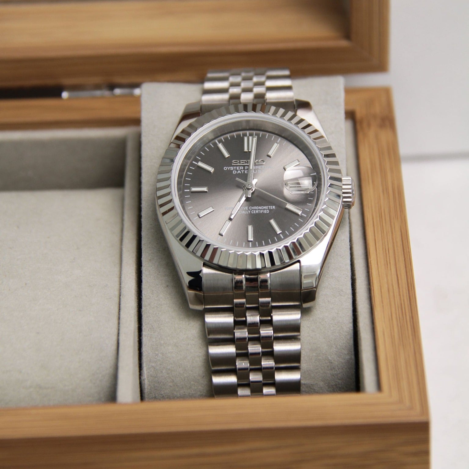 Seiko Moddys Datejust Grey Front View front view grey sunburst dial with fluted bezel and applied markers