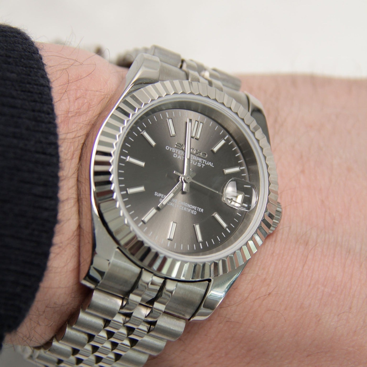 Seiko Moddys Datejust Grey Wrist View wrist shot focus on dial reflection and curvature of steel bracelet