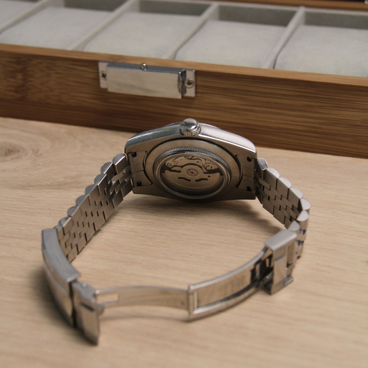 Rear view showing Seiko Mod Datejust Ice Blue Arabic caseback with open automatic movement