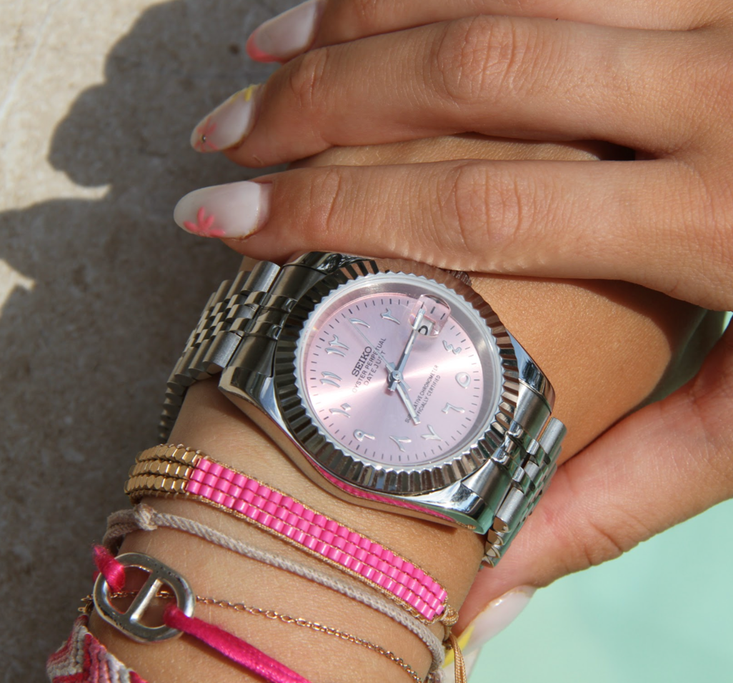 Seiko Mods Datejust Rose Arabic on wrist with bracelets and sunlight reflections