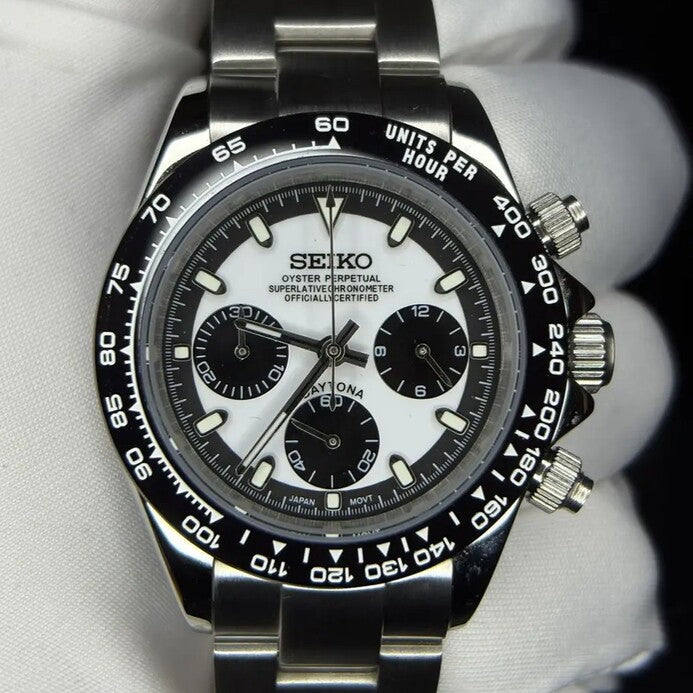 Seiko Mod Daytona Panda front view with white dial, black subdials and black ceramic bezel on stainless bracelet