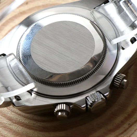 Close up of Seiko Mod Daytona Platinum screw down caseback and crown area, brushed finish visible.