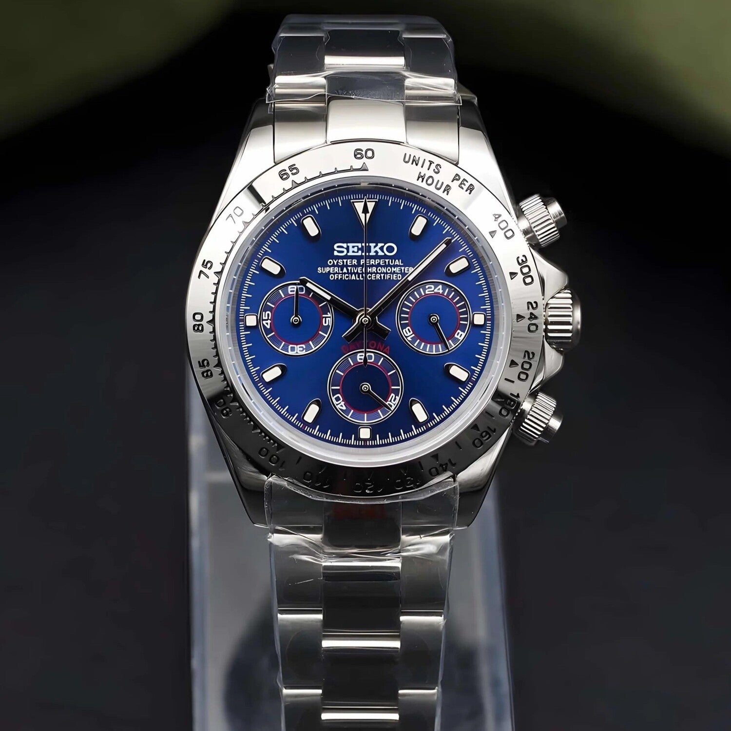 Front view of Seiko Mod Daytona in stainless steel with metallic royal blue dial and red accented subdials