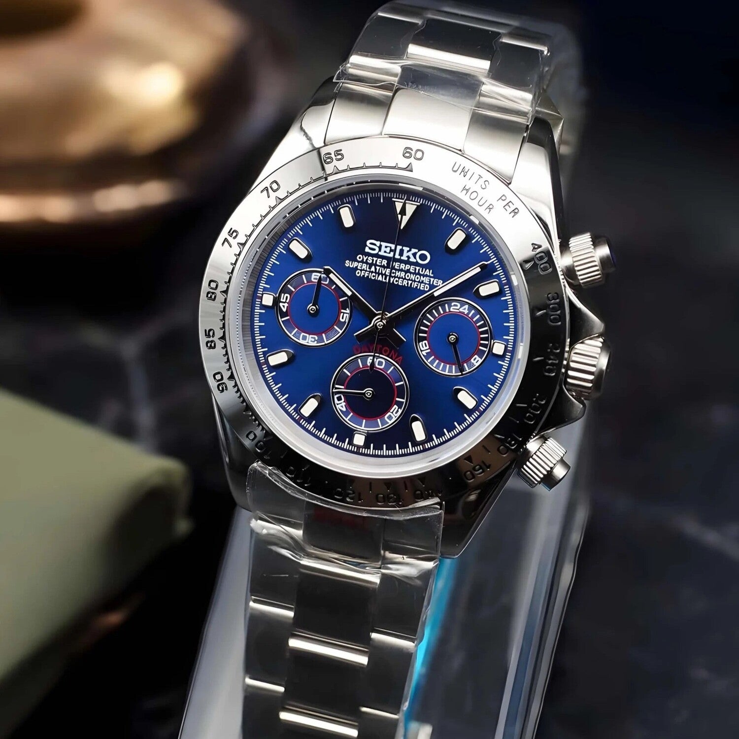 Right angled view of Seiko Mod Daytona in steel with metallic royal blue dial, silver bezel and polished bracelet.