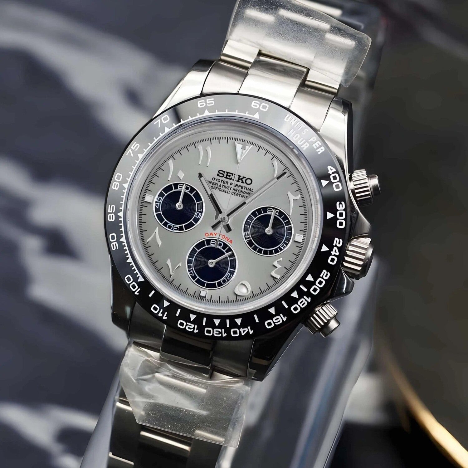 Seiko Mods Daytona. Watch photographed from the right side, emphasizing the case shape, crown, chronograph pushers, and the silver Arabic dial.