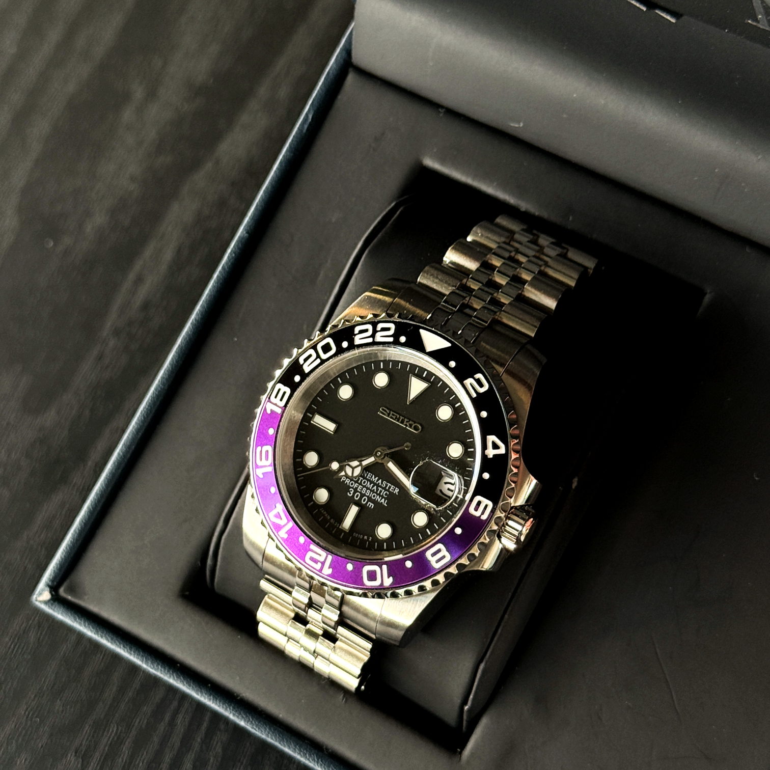 Angled right view Seiko Mod GMT Joker emphasizing crown position and polished case edges