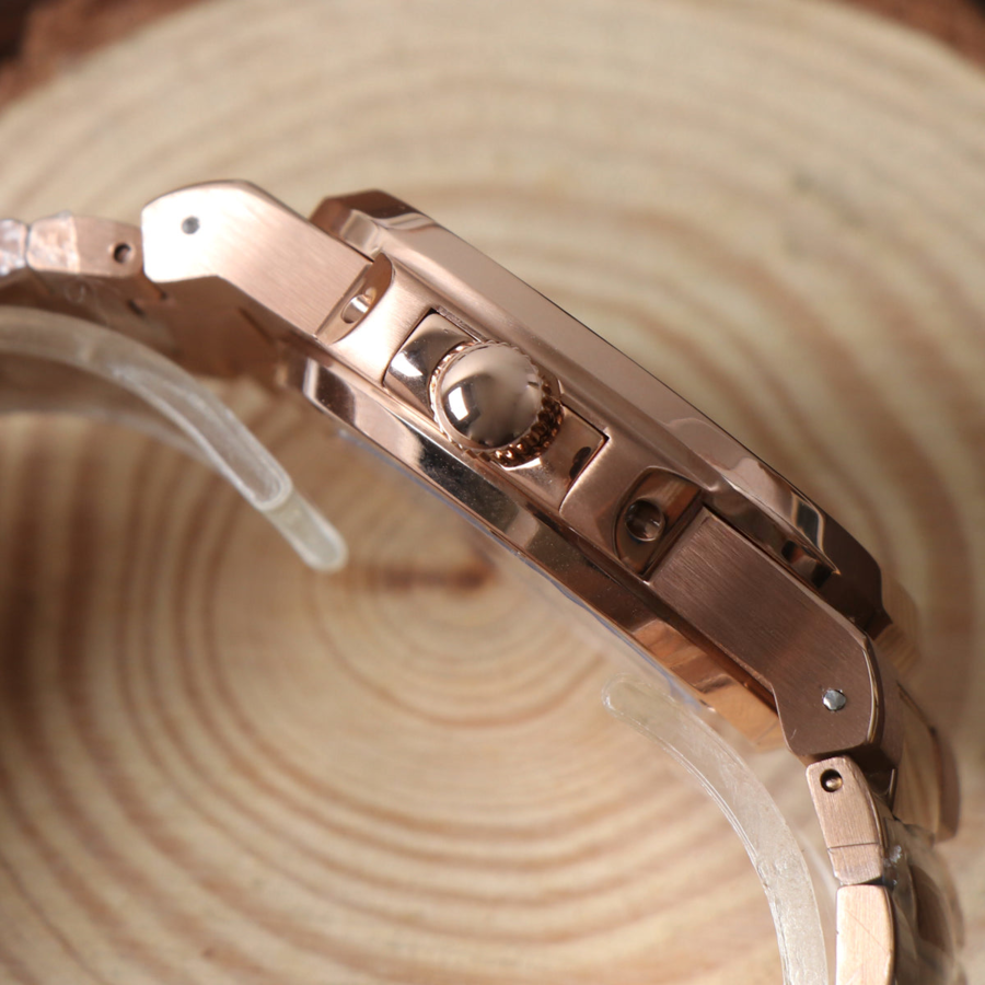 Crown detail of Seiko mod Nautilus rose gold royal blue edition emphasizing brushed and polished transitions