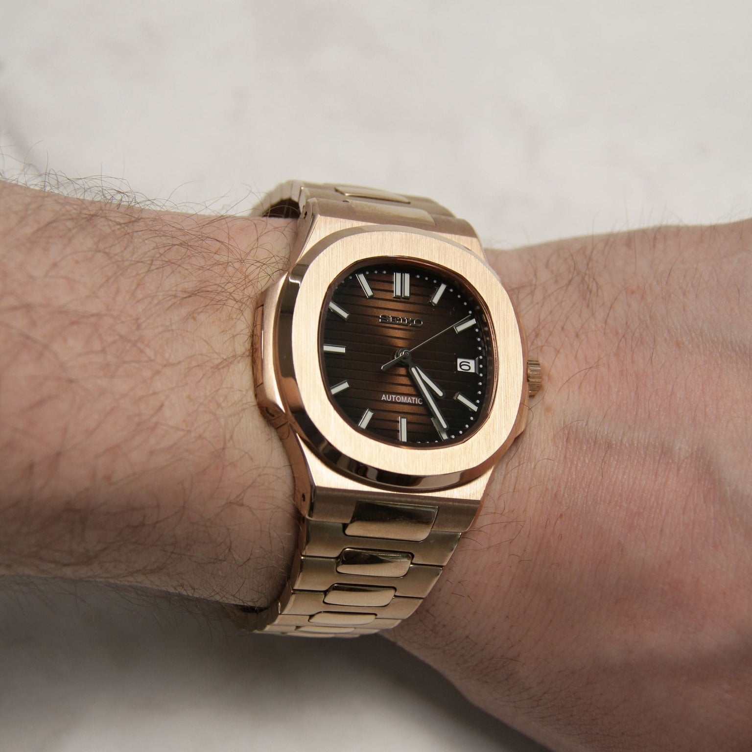 Wrist shot Seiko Mod Nautilus Chocolate displaying elegant fit and contrast against skin tone