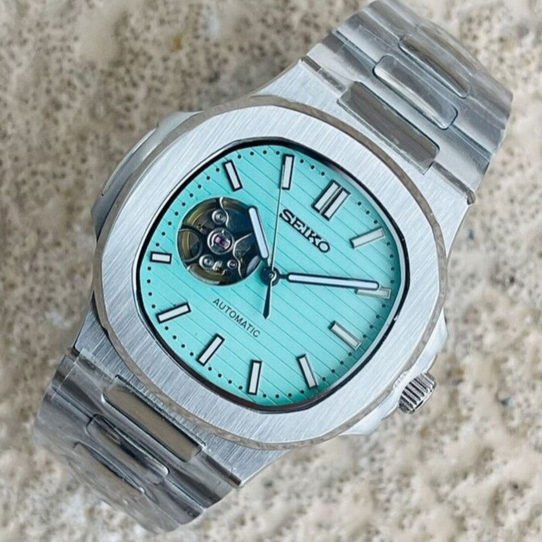 Top view Seiko Mod Nautilus Tiffany Open Heart capturing dial texture and integrated bracelet design