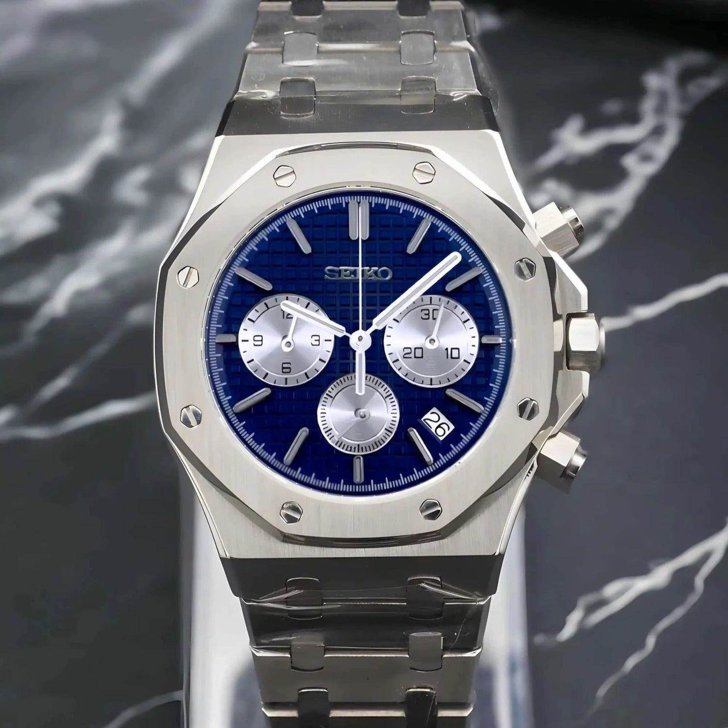 Front view of the Seiko Mod Royal Oak VK63 chronograph featuring a blue textured dial with three silver subdials, brushed stainless steel octagonal bezel, and functional pushers on the case side