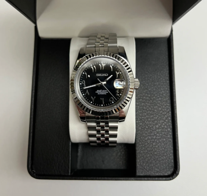 Seiko Mod Datejust Black Arabic displayed in watch box with fluted bezel and polished case