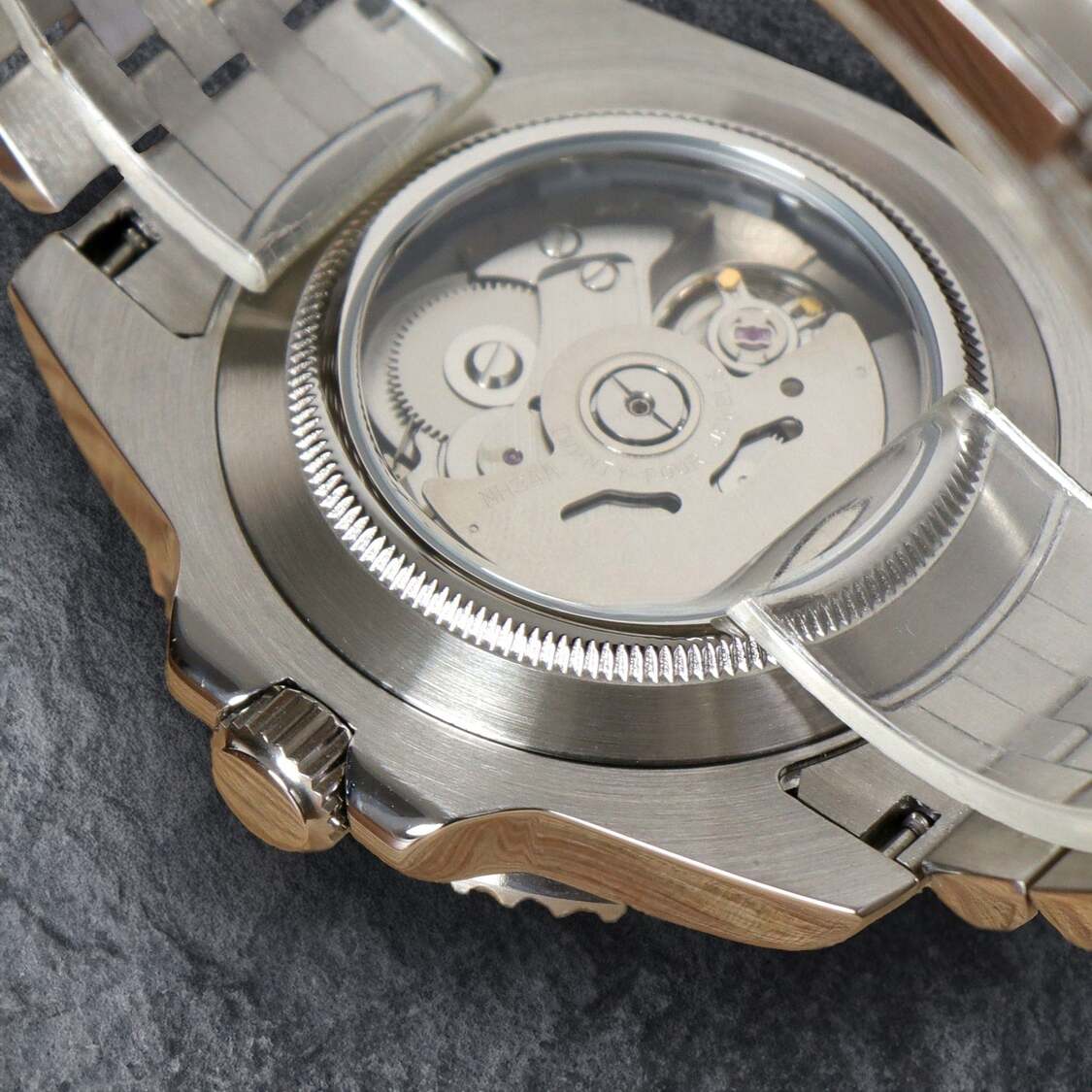 Macro shot of Seiko Moddys Datejust Black Arabic NH35 movement rotor and caseback details