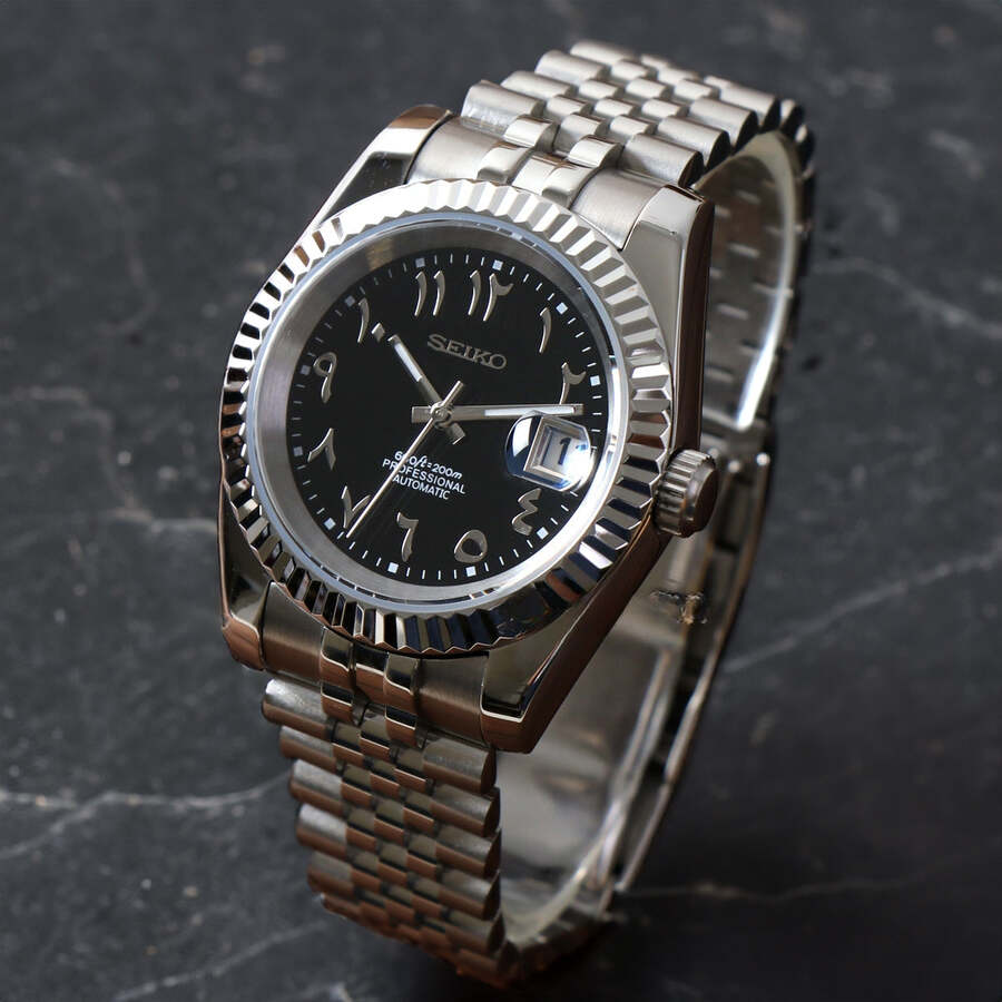 Right three quarter angle of Seiko Mod Datejust Black Arabic on dark surface highlighting polished finish