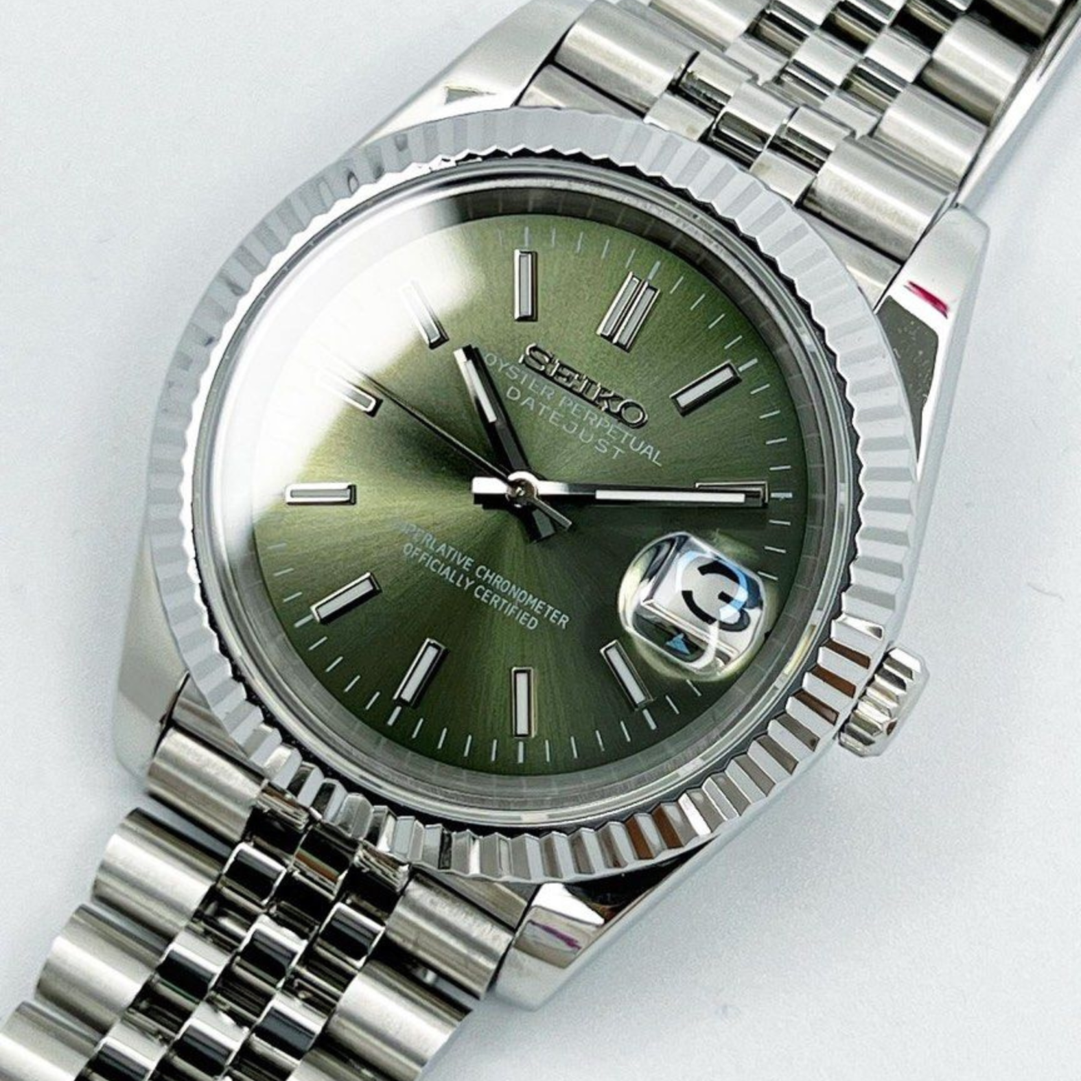 Overhead top view of Seiko Moddys Datejust Mint Green Dial watch with stainless steel jubilee bracelet