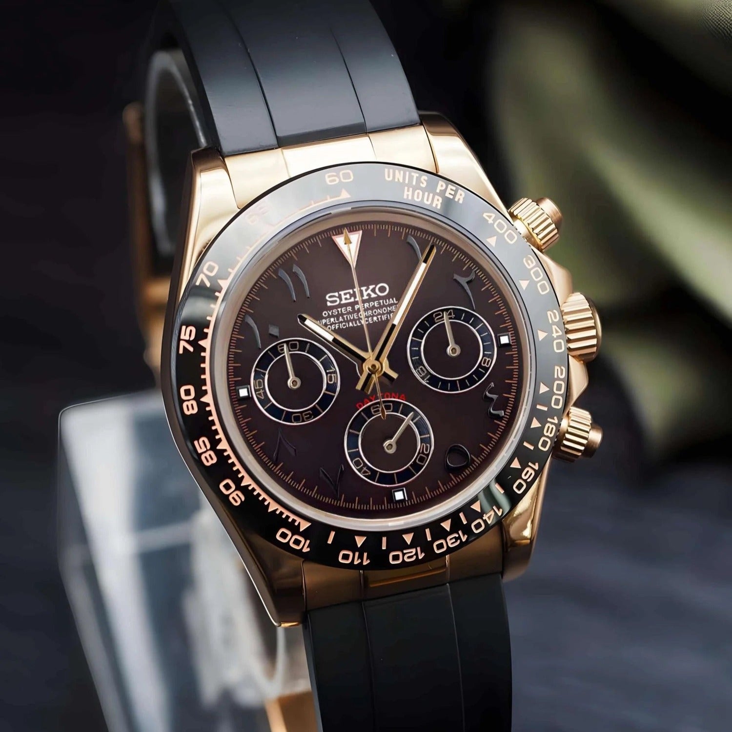 Seiko Mod Daytona brown Arabic dial in rose gold case, viewed from the left angle with visible crown and pushers.