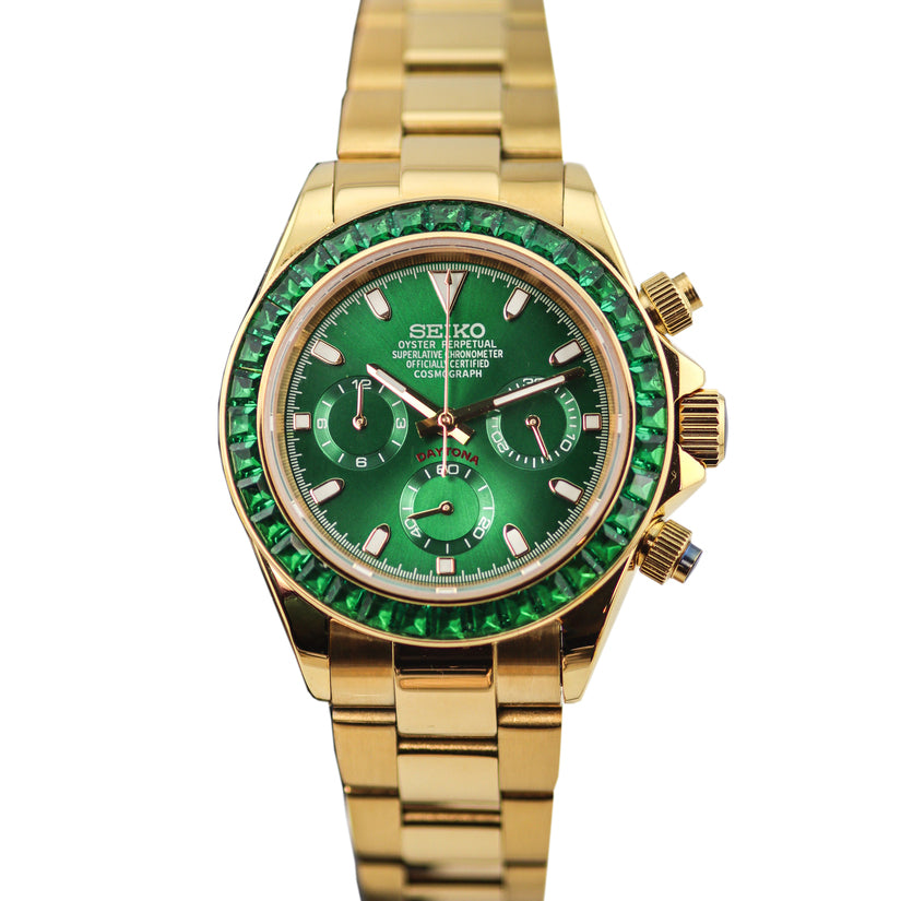 Seiko Moddys Daytona Green Emerald front view, gold case and bracelet with vivid green dial, three subdials, and gemstone-set bezel.