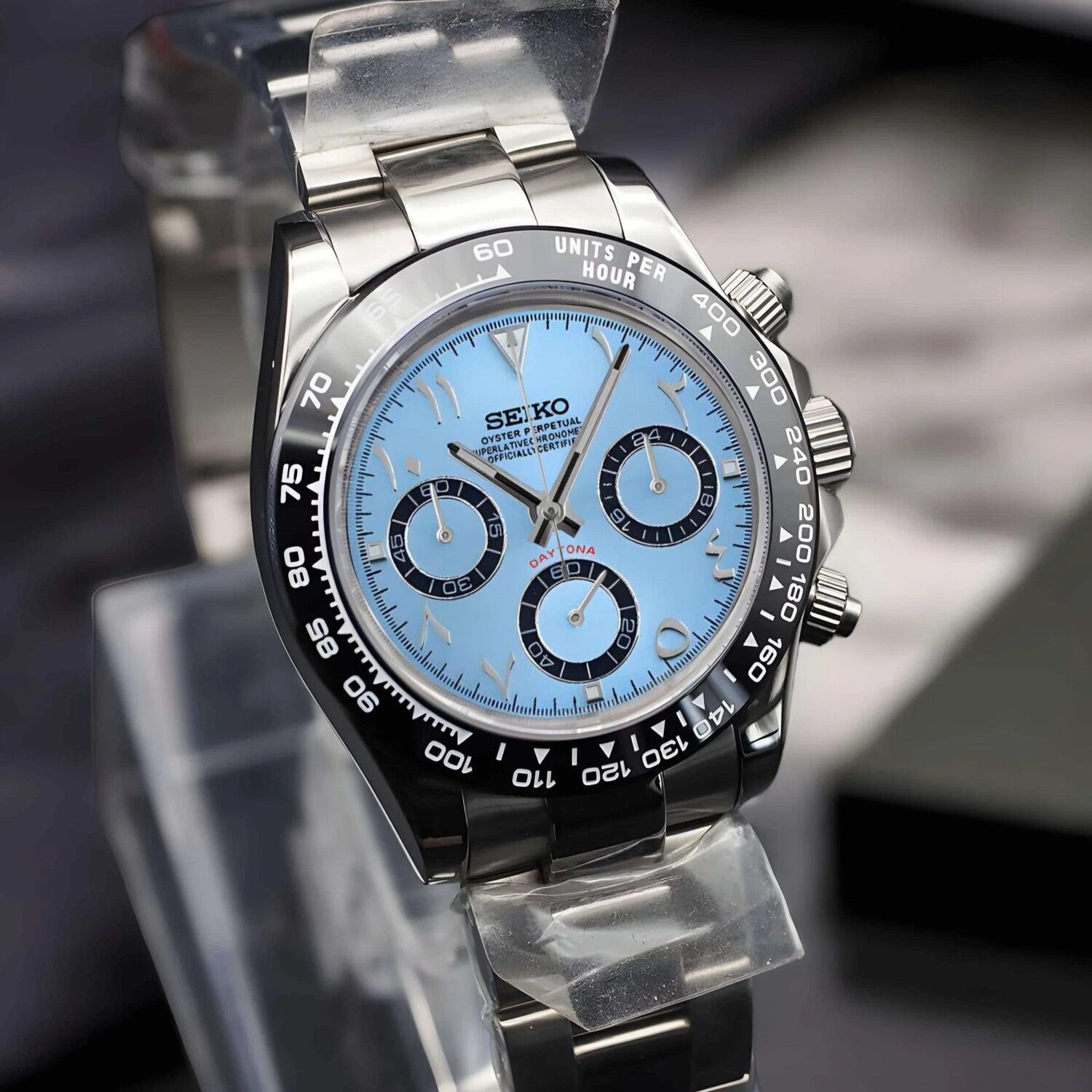 Left angled shot of Seiko Mod Daytona ice blue Arabic dial, showcasing subdials and polished case.