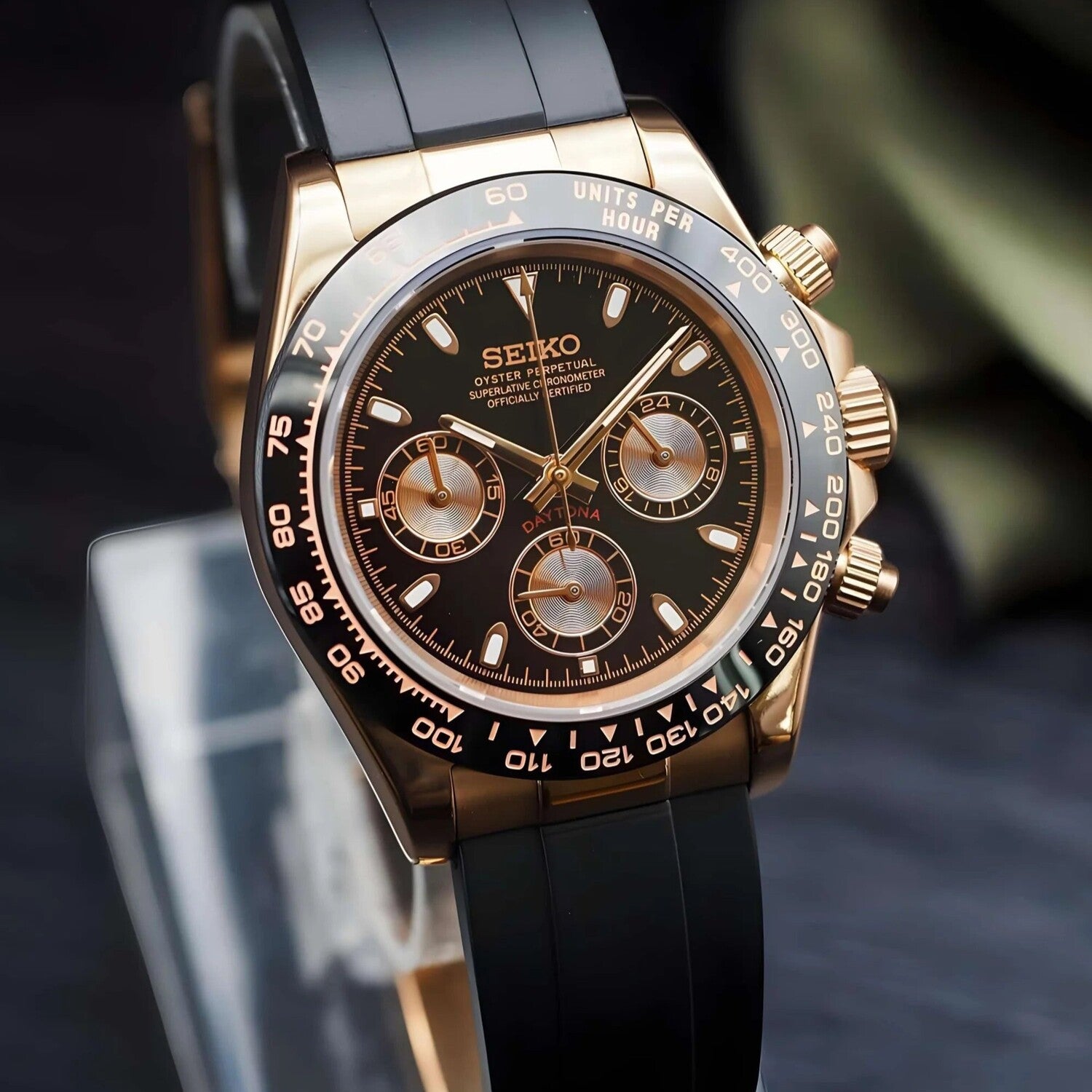 Left angled view of the Seiko Mod Daytona in rose gold, highlighting the polished case, black dial, and chronograph layout.