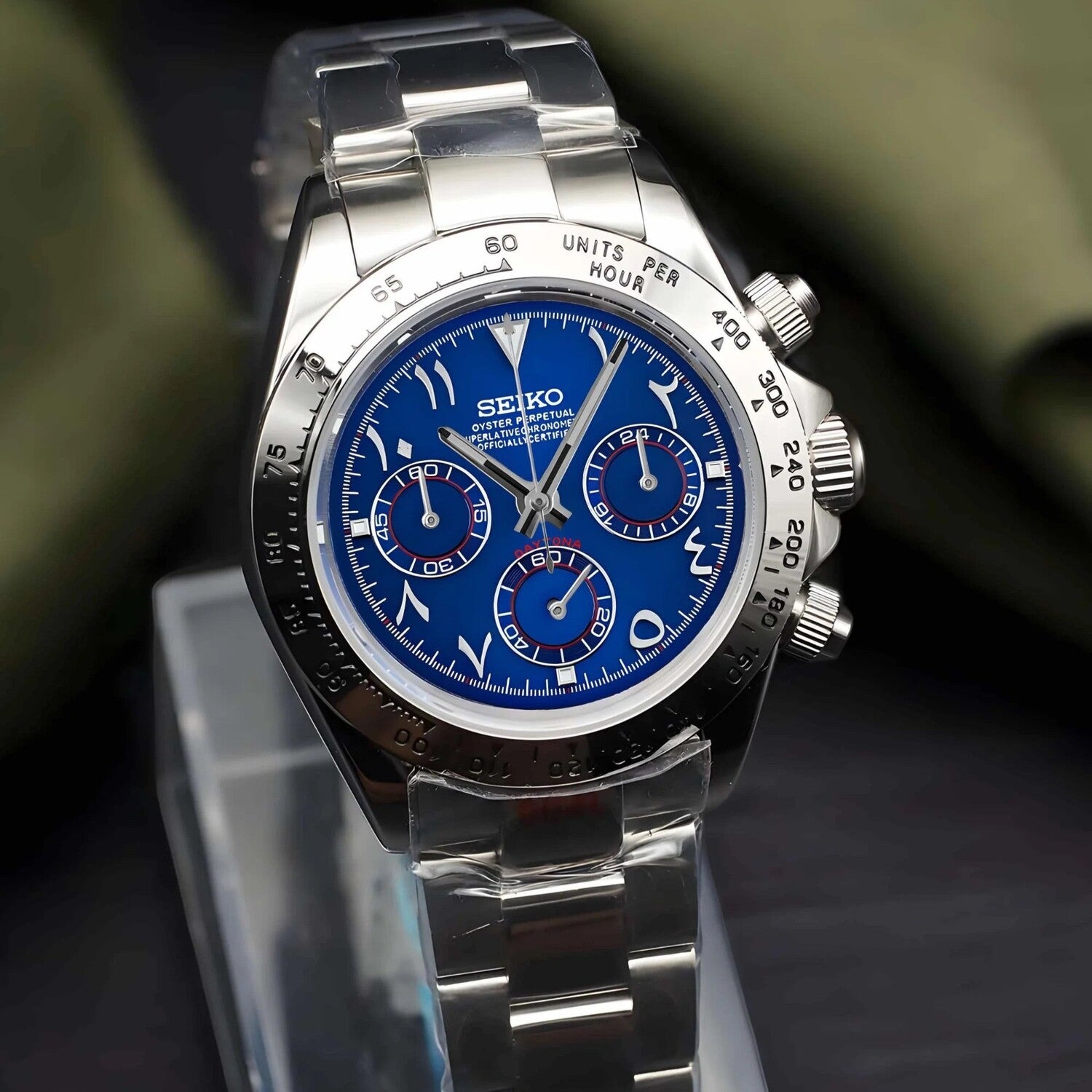 Seiko Mod Daytona Royal Blue Arabic angled view with bold blue dial, silver bezel, and polished steel bracelet.