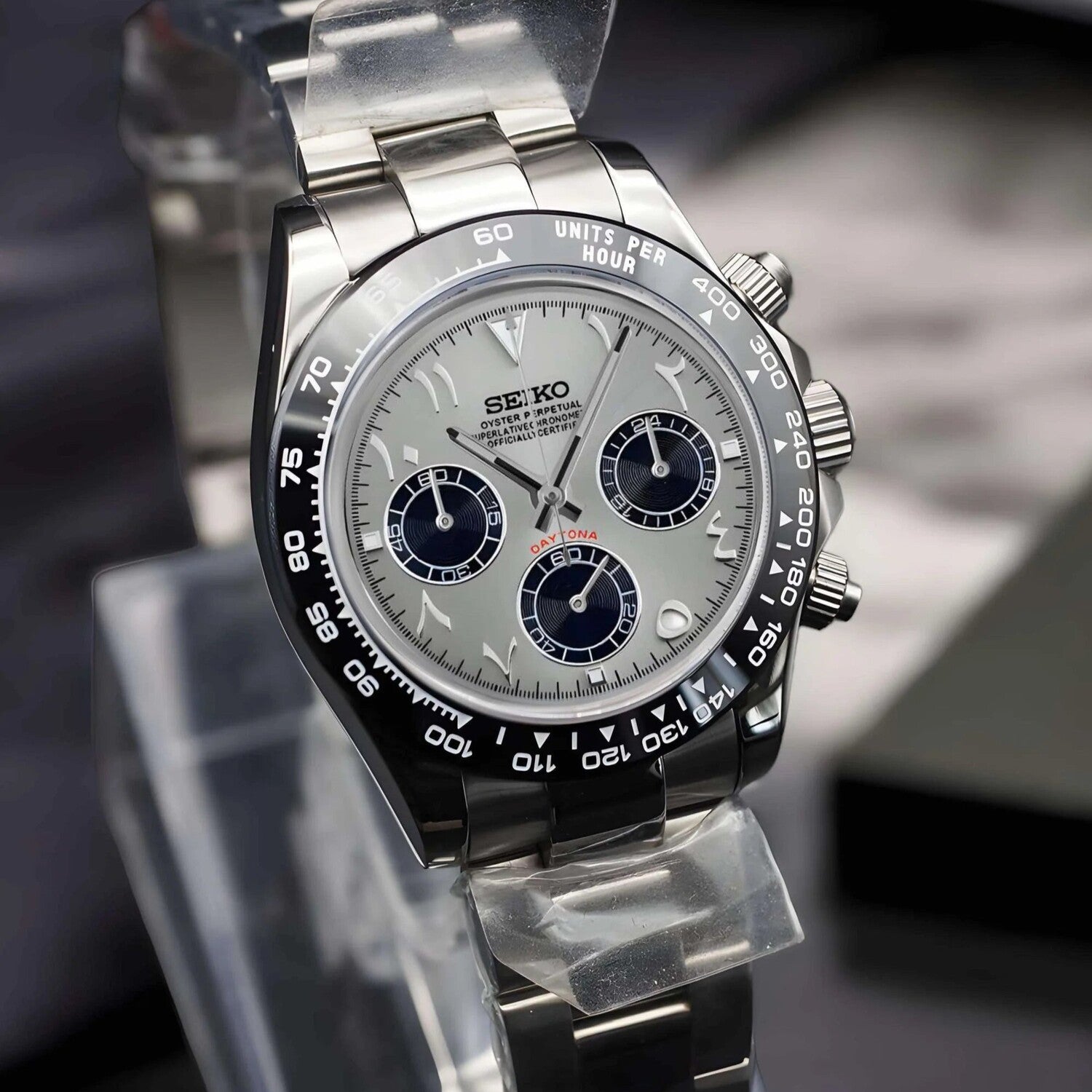 Seiko Mod Daytona Silver Arabic Left angled view: Watch captured at a left three-quarter angle, showing the case flanks, pushers, crown, and detailed dial.