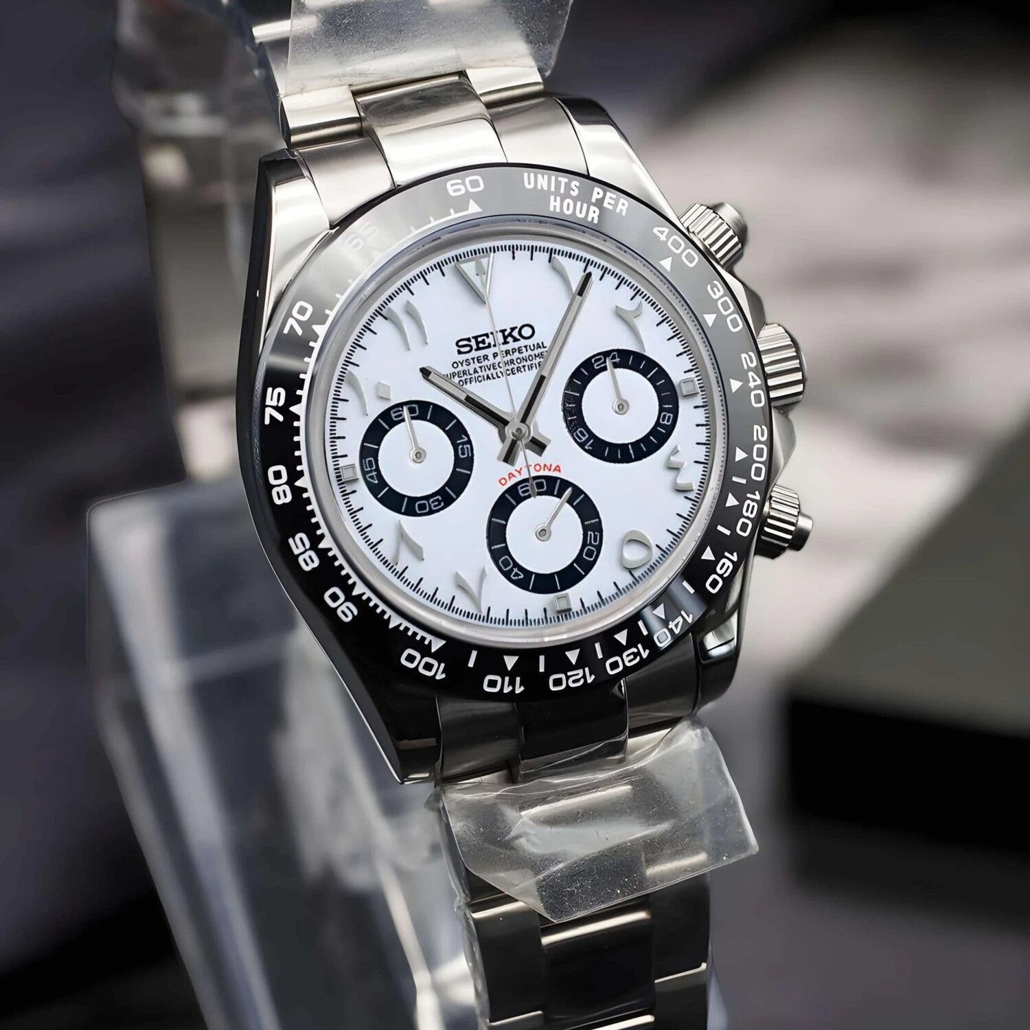 Seiko Mod Daytona angled view showing polished steel bracelet and detailed white Arabic dial design