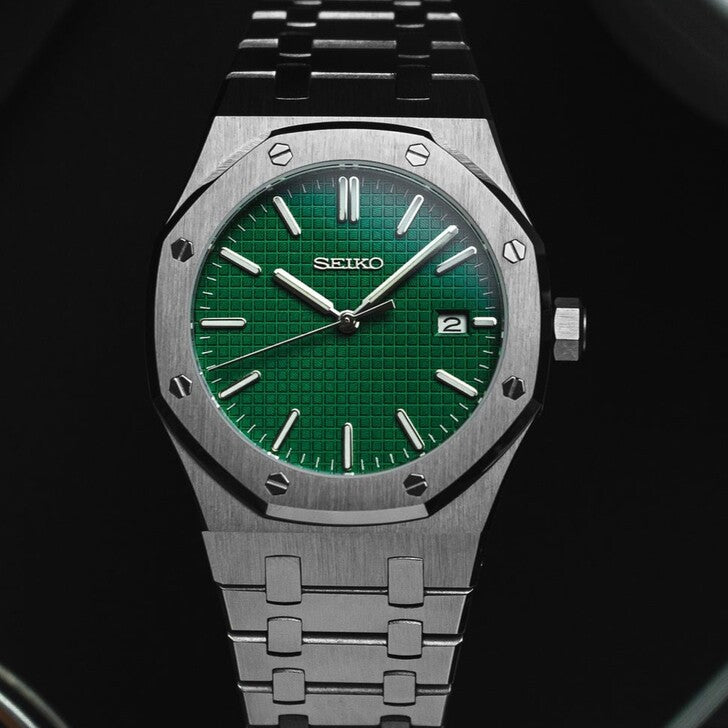 Top view of the Seiko Mod Royal Oak with brushed stainless steel case, vivid green textured dial, applied silver hour markers, and integrated steel bracelet.