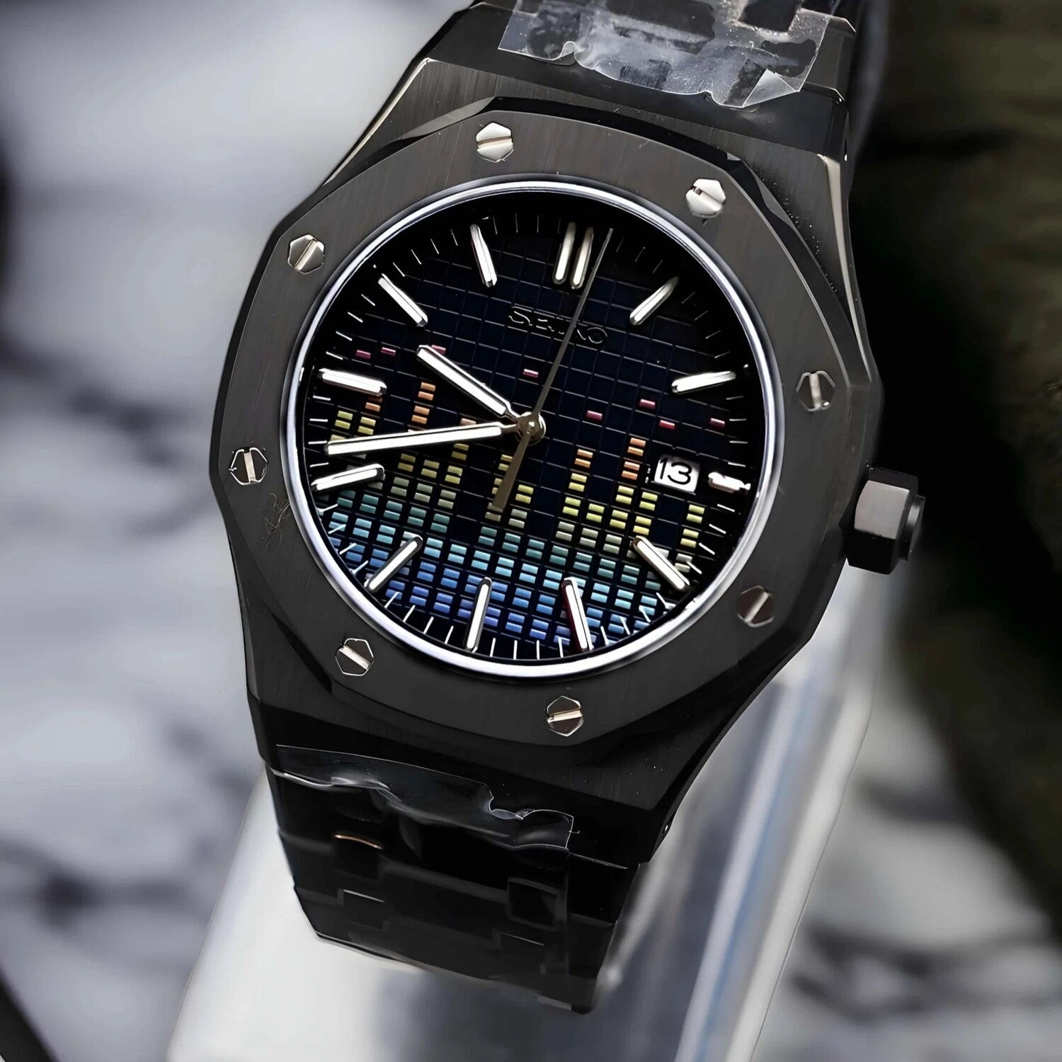 Right angled close up of Seiko Mod Royal Oak Music Dial Black, featuring the NH35 automatic movement, rainbow soundwave dial, and brushed octagonal bezel.