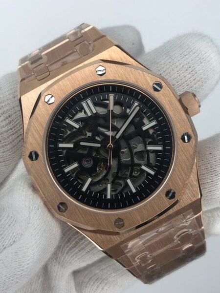 Front view of the Seiko Mod Royal Oak Skeleton in rose gold, showcasing the open worked dial that reveals the mechanical movement, framed by a brushed octagonal bezel with polished screws and a matching rose gold bracelet.